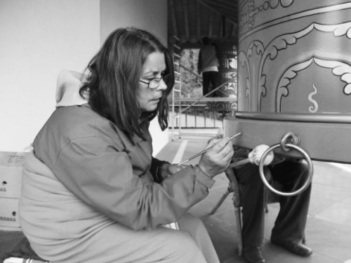 The artist K. Seiss is pictured (above) painting one of the twenty-one Tibetan Buddhist prayer wheels onsite at Tashi Rabten in Austria (September 2015).