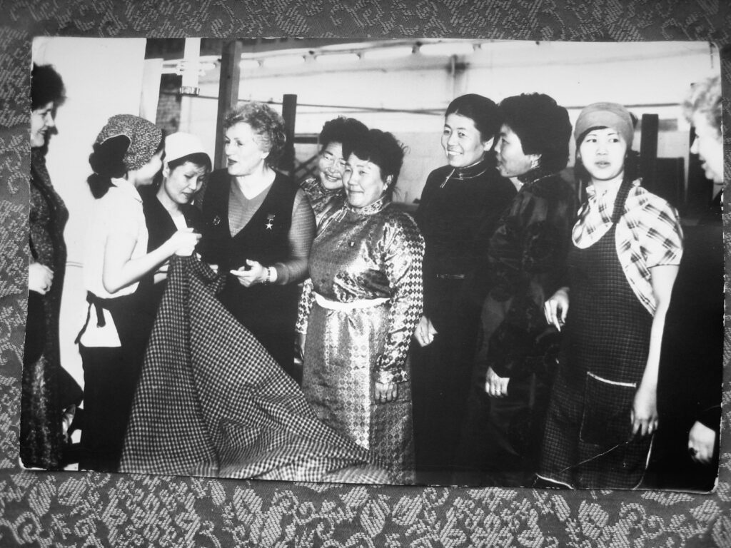 Visiting the sewing factory in Khakhasia in 1985. Photo 2 of 2. Handmaa (centre right. Photograph courtesy of J.Avrazed. Reprinted on CPinMongolia.com with permission.