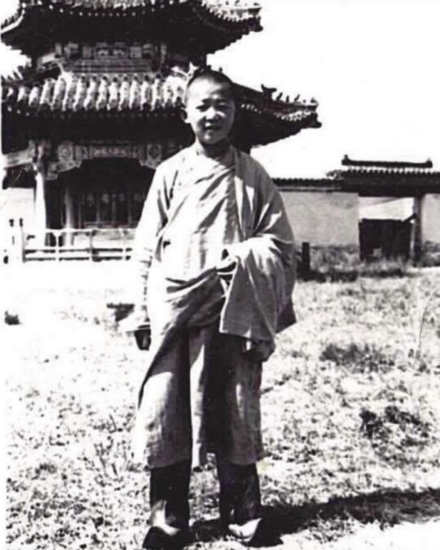 Zava Damdin Luvsandarjaa (b. 1976), pictured here as a young lama, standing in front of one of the smaller temples of Amarbayasgalant Monastery (Амарбаясгалант хийд), a Gelugpa monastery in the Iven Valley, Selenge Aimag, northern Mongolia, where he lived and studied with his younger brother, Dugarjav Bilguun, and later taught before relocating to his seat at Delgeruun Choira in the Gobi. At the time of the photograph, the temples and the vast precinct were still awaiting restoration. Built between 1727 and 1736, the monastery complex was dedicated to Öndör Gegeen Zanabazar (1635–1723), the first Bogd and Buddhist leader of Mongolia, who also founded the Mongolian school of religious art. Laid out symmetrically, with buildings arranged successively along a north–south axis, the complex displays a strong stylistic unity. Its dominant architectural style is Chinese, with some Mongolian influence. Amarbayasgalant was one of the few Mongolian monasteries to partially survive the Stalinist purges of 1937. Although buildings beyond the central section were destroyed, 28 original buildings in the central complex remained. Restoration began in 1988 with support from Mongolian’s famous prelate Lobsang Tenzin Gyatso Pal Sangpo, Guru Deva Rinpoche (1908–2009), and UNESCO. Photograph date unknown. Courtesy of our friend Naran Davaa. Accessed 5 July 2026. Reprinted with permission of the Zava Damdin Sutra and Scripture Institute of Mongolia.